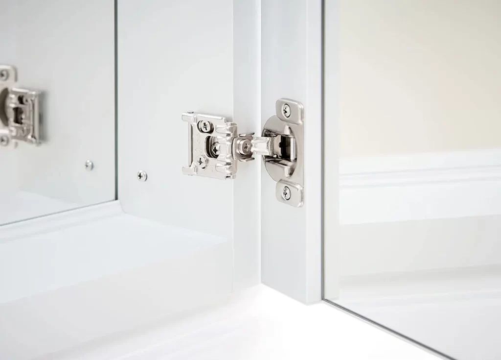 Soft-close hinges in bathroom mirror cabinets: the doors open and close smoothly; long-lasting performance is ensured, even with frequent use in humid bathroom environments.