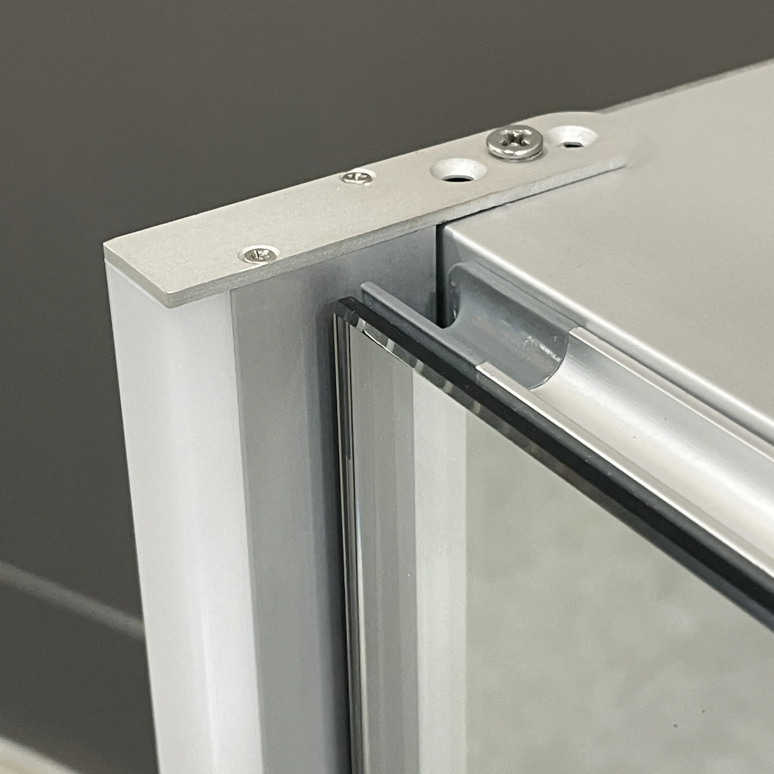 Aluminum bathroom mirror cabinet with soft-glow side LED lights and hand-sweep sensor.