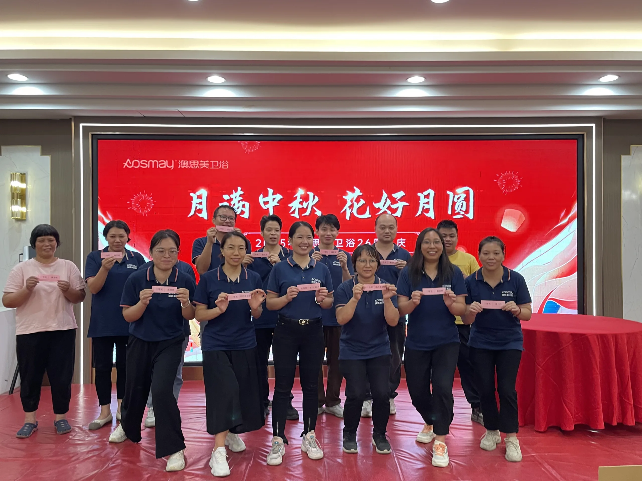 Management presenting prizes to staff - specialist in custom medicine cabinets.