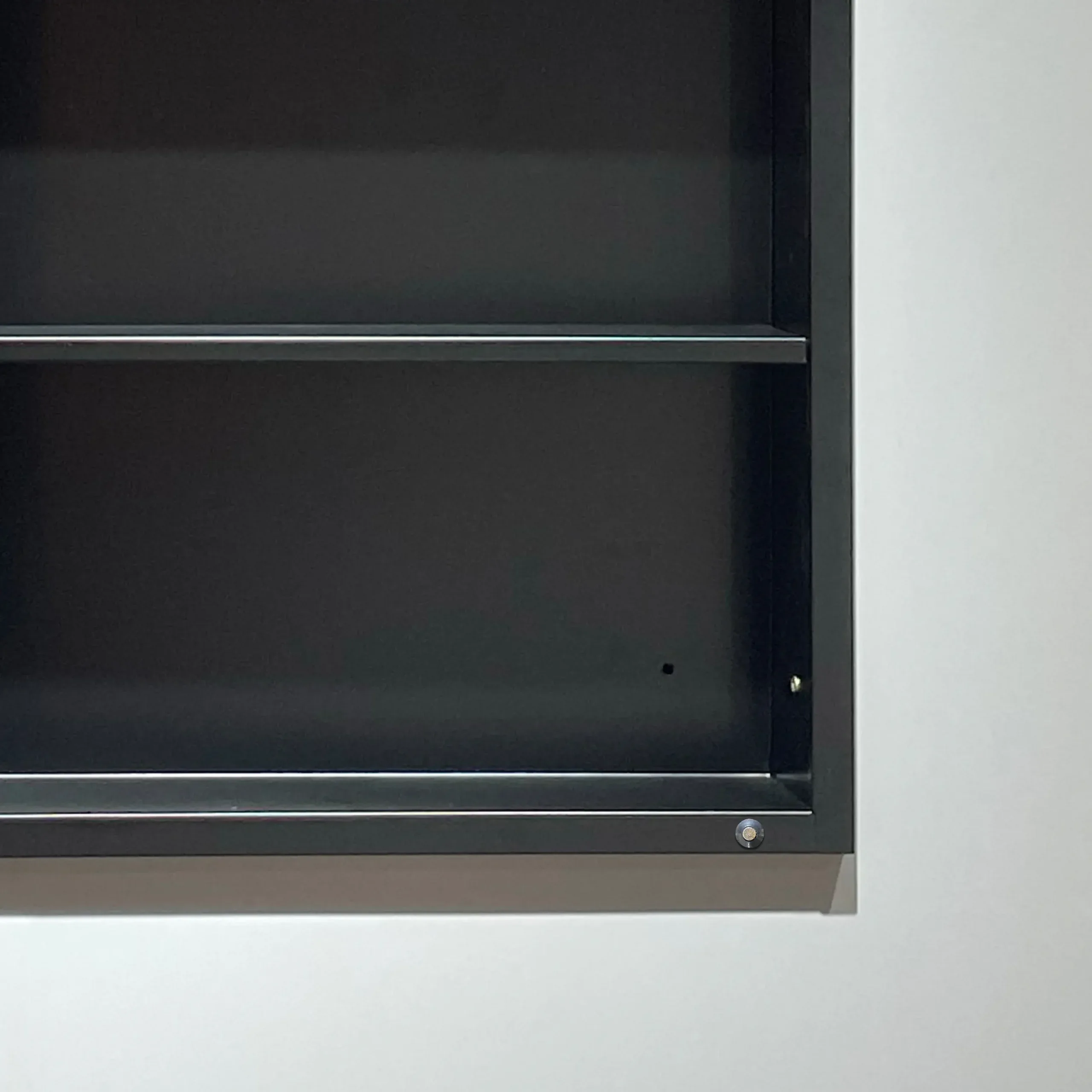 Black bathroom mirror cabinet with durable powder-coated iron shelves, designed for modern commercial and residential projects.
