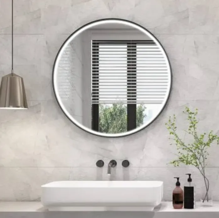 Black framed aluminum LED bathroom mirror installed in a modern hotel