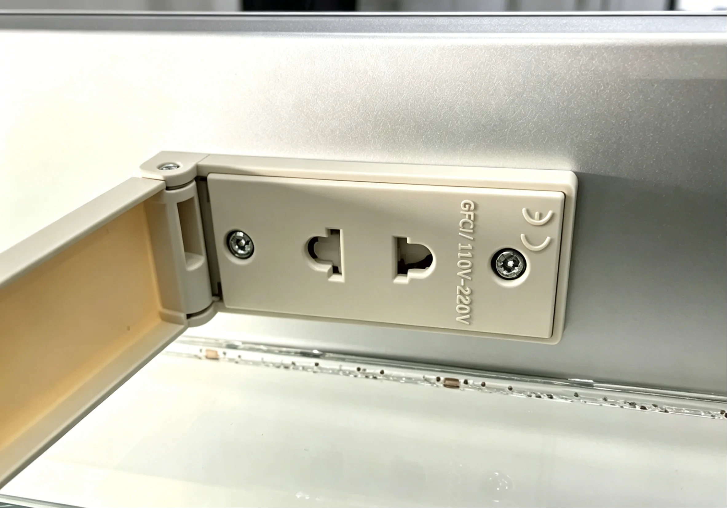 Safe and waterproof GFCI shaving socket built into a modern custom LED mirror for international hotels.