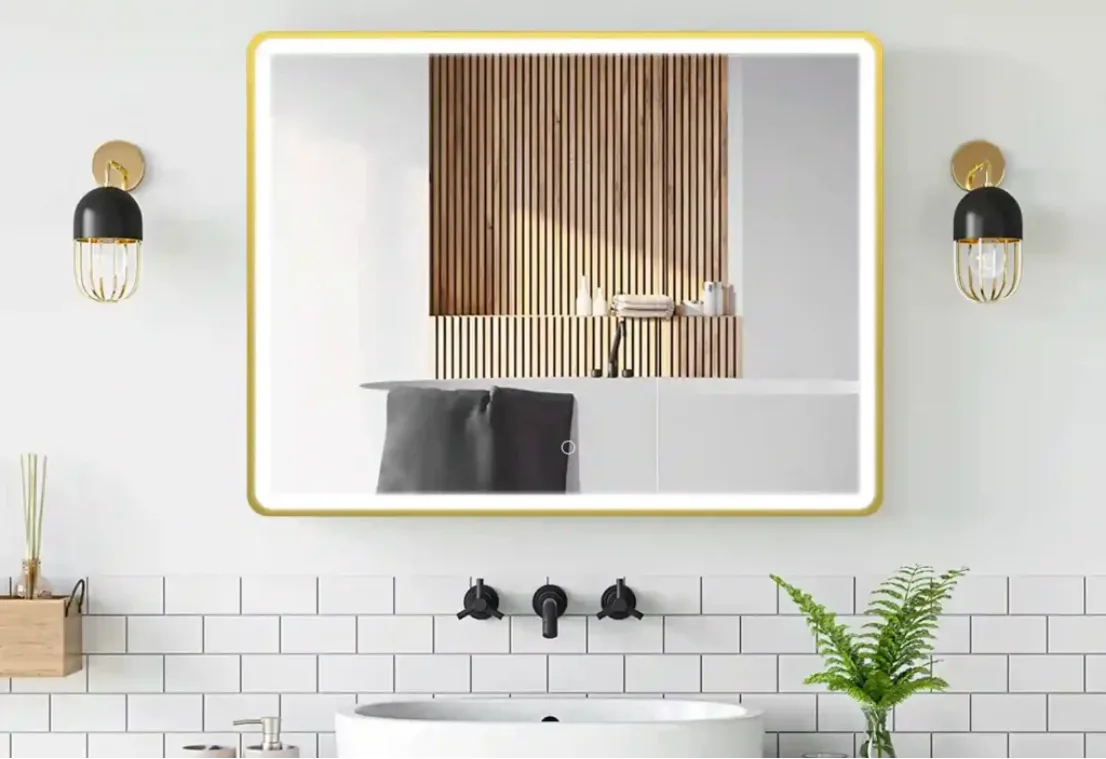 Luxury brushed gold bathroom mirror frame featuring PVD surface treatment to prevent rust in high-humidity environments.